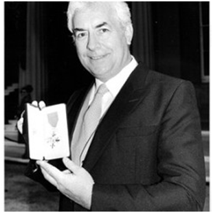 Ron Pickering receiving his OBE-Picture courtesy of the Ron Pickering Memorial Fund